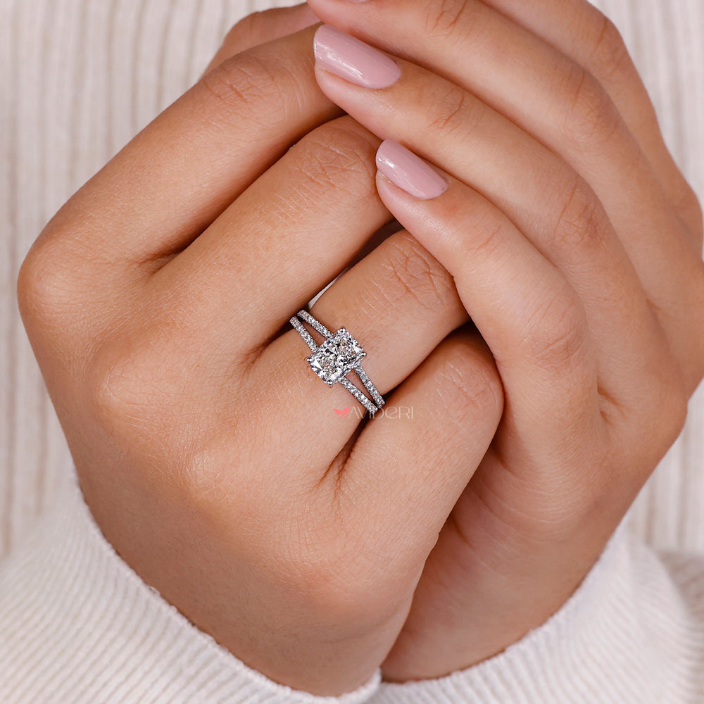 Unique engagement ring with a radiant diamond in white gold and diamond accents.

