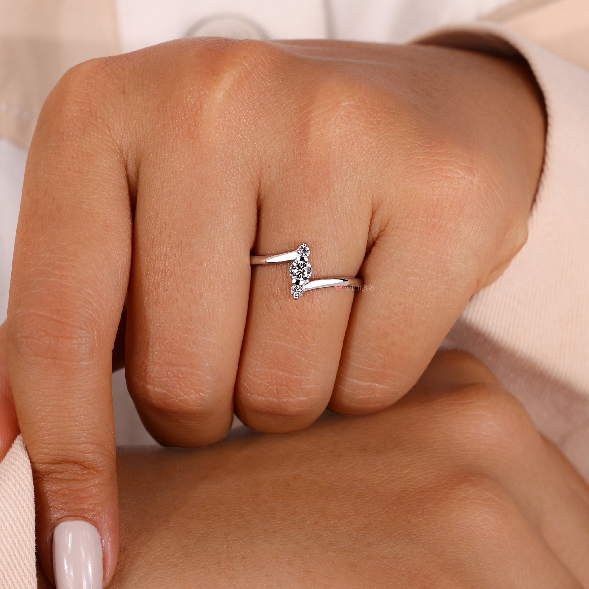 Round cut diamond ring in a prong setting ring.
