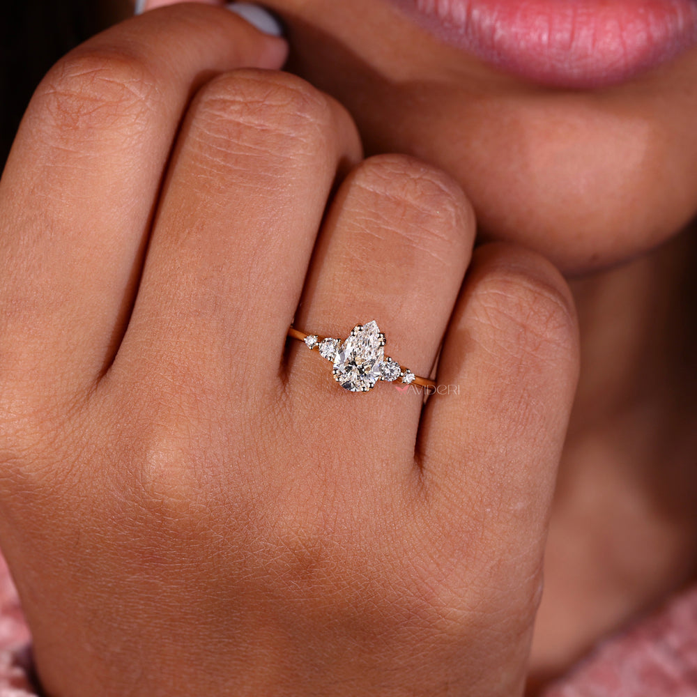 Avideri engagement ring with 5 stone engagement ring style and four round diamonds with side stones for brilliance.
