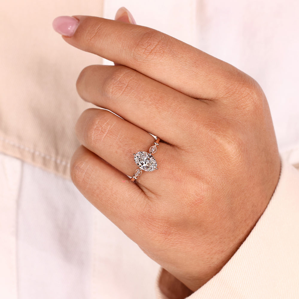 Milgrain engagement ring with round brilliant cut diamond and handmade jewelry craftsmanship for a sophisticated style.
