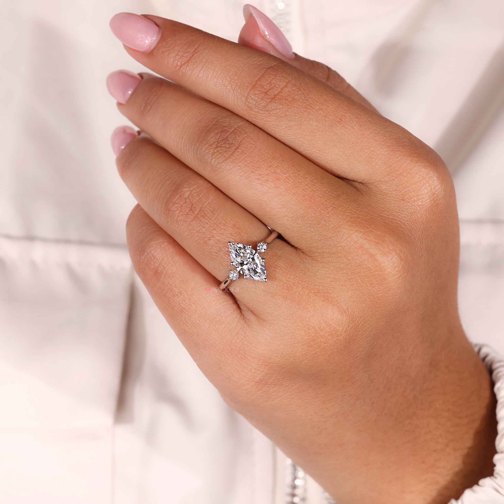 6 prong setting featuring a unique marquise diamond engagement ring.