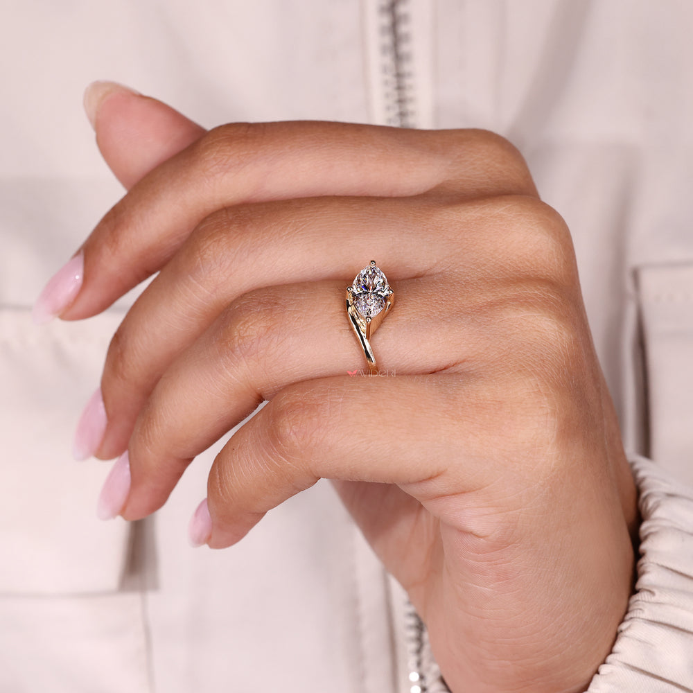 Marquise diamond ring with prong setting style.
