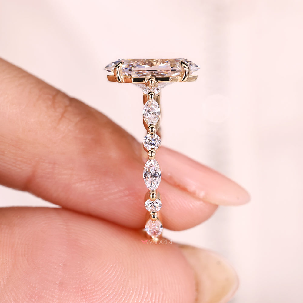 Dutch marquise diamond ring with pave band.
