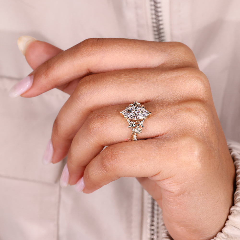 Lab grown marquise diamond ring with pave accents.
