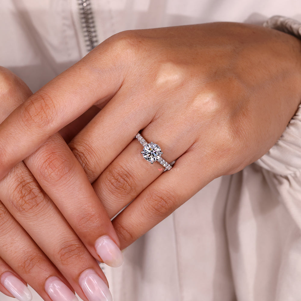 Cathedral style round diamond ring with hidden halo.
