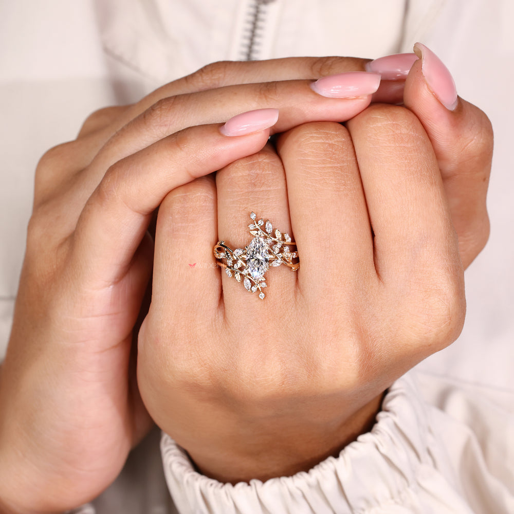 Marquise ring with round diamond enhancer.
