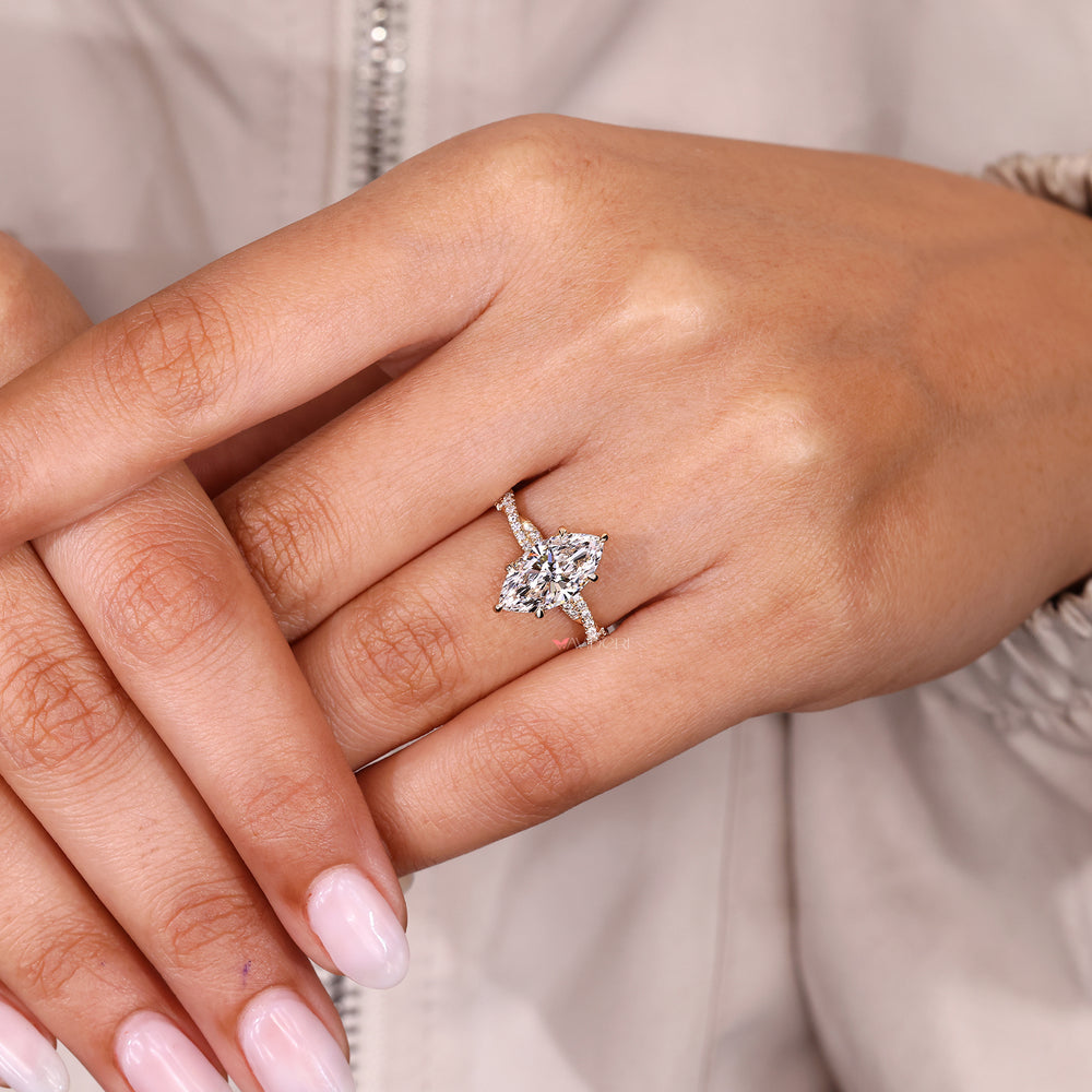 Lab grown marquise diamond ring with subtle hidden halo.
