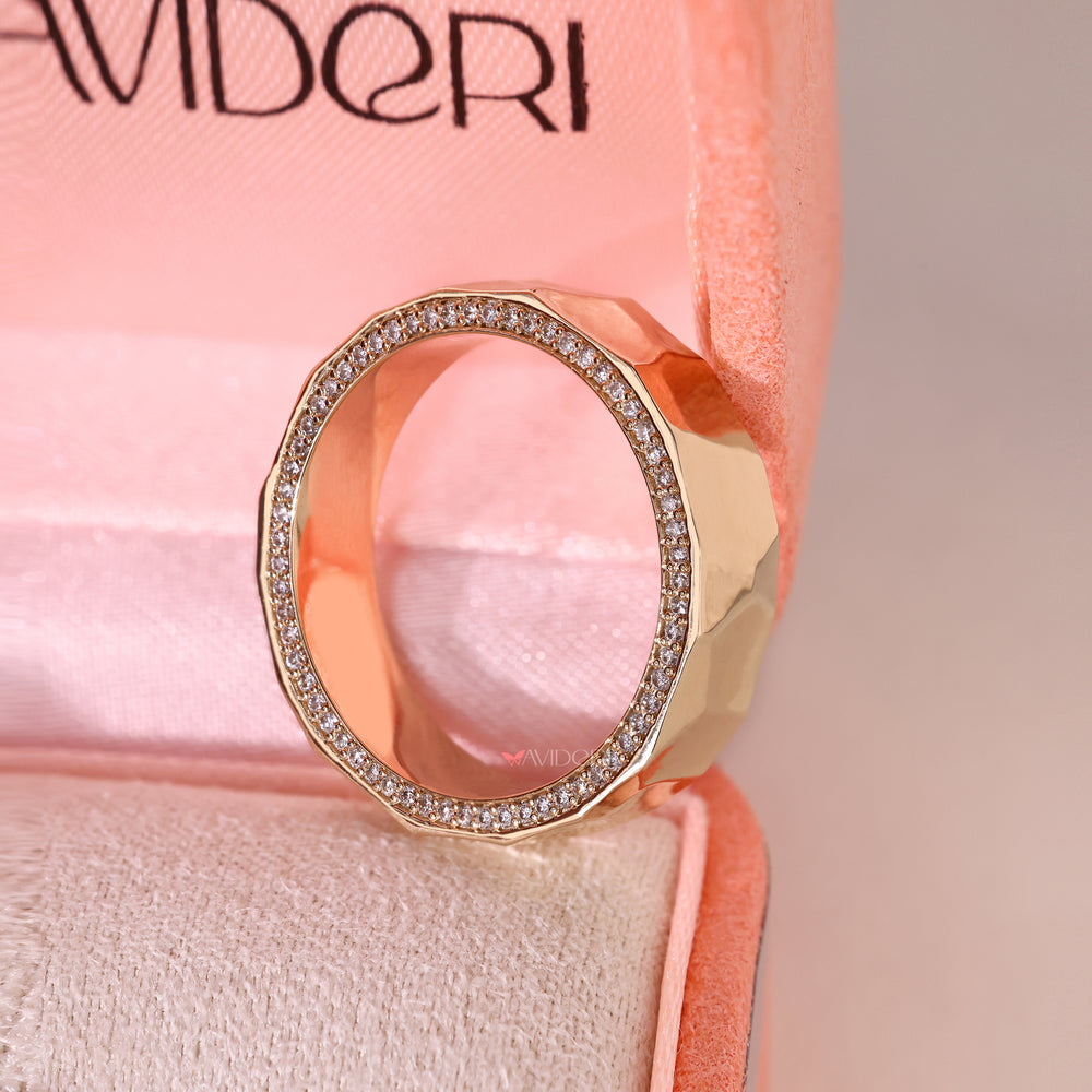 Round cut diamond band with hammered finish wedding style.
