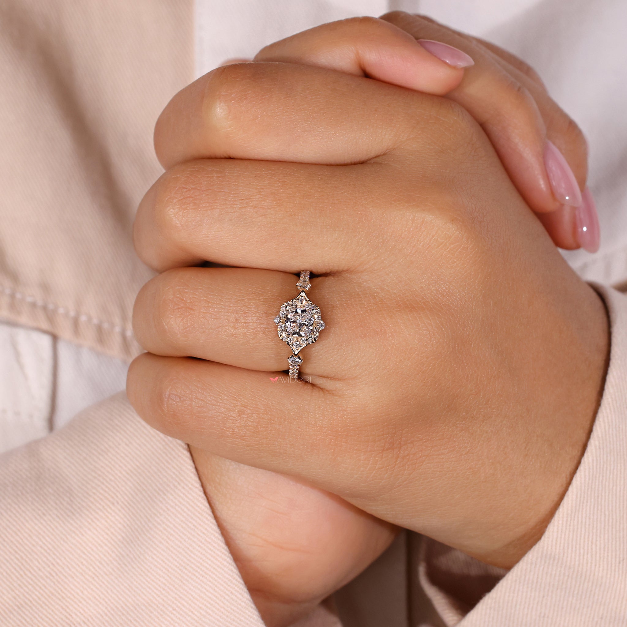 Halo diamond ring with princess cut center stone.