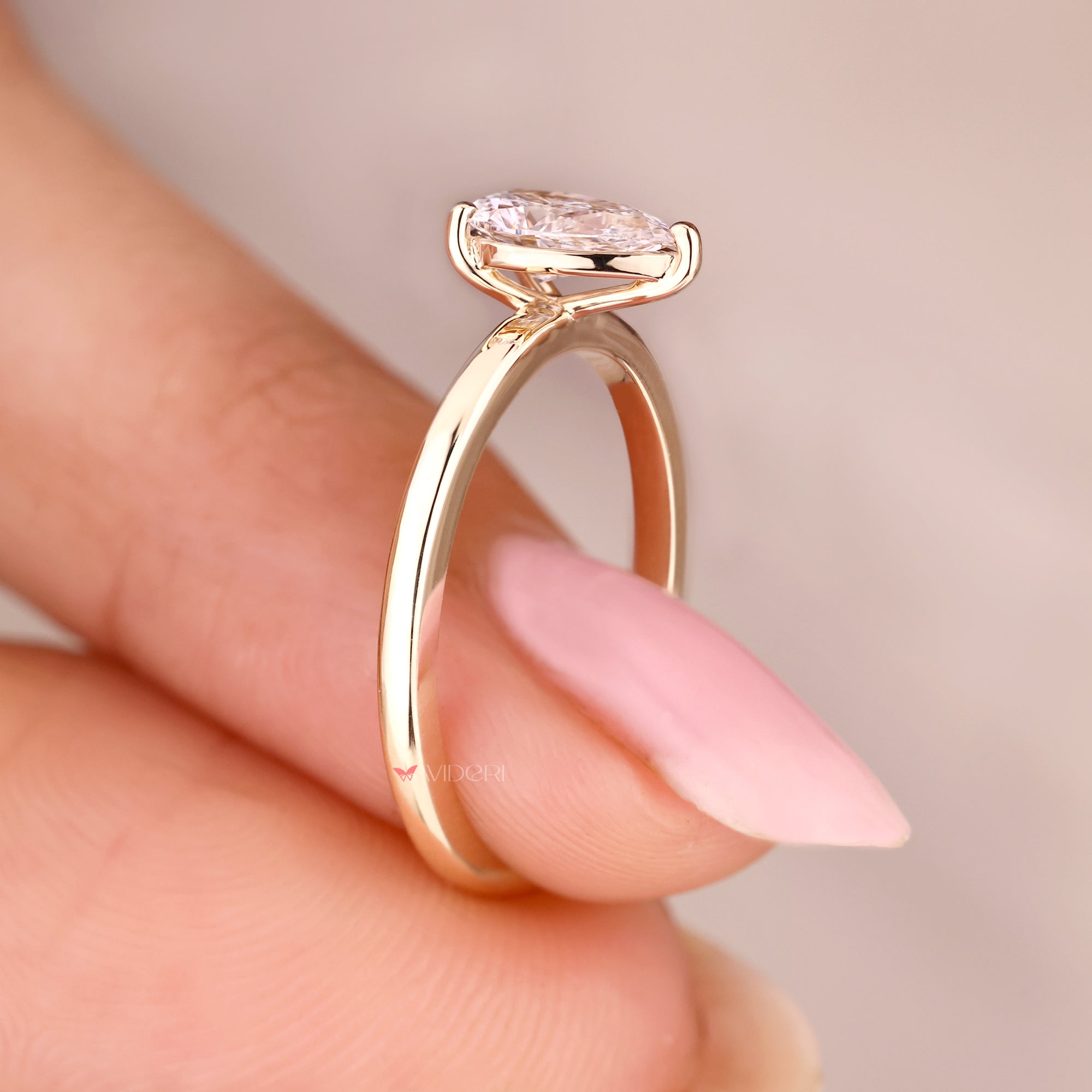 Lab grown pear cut diamond ring design.
