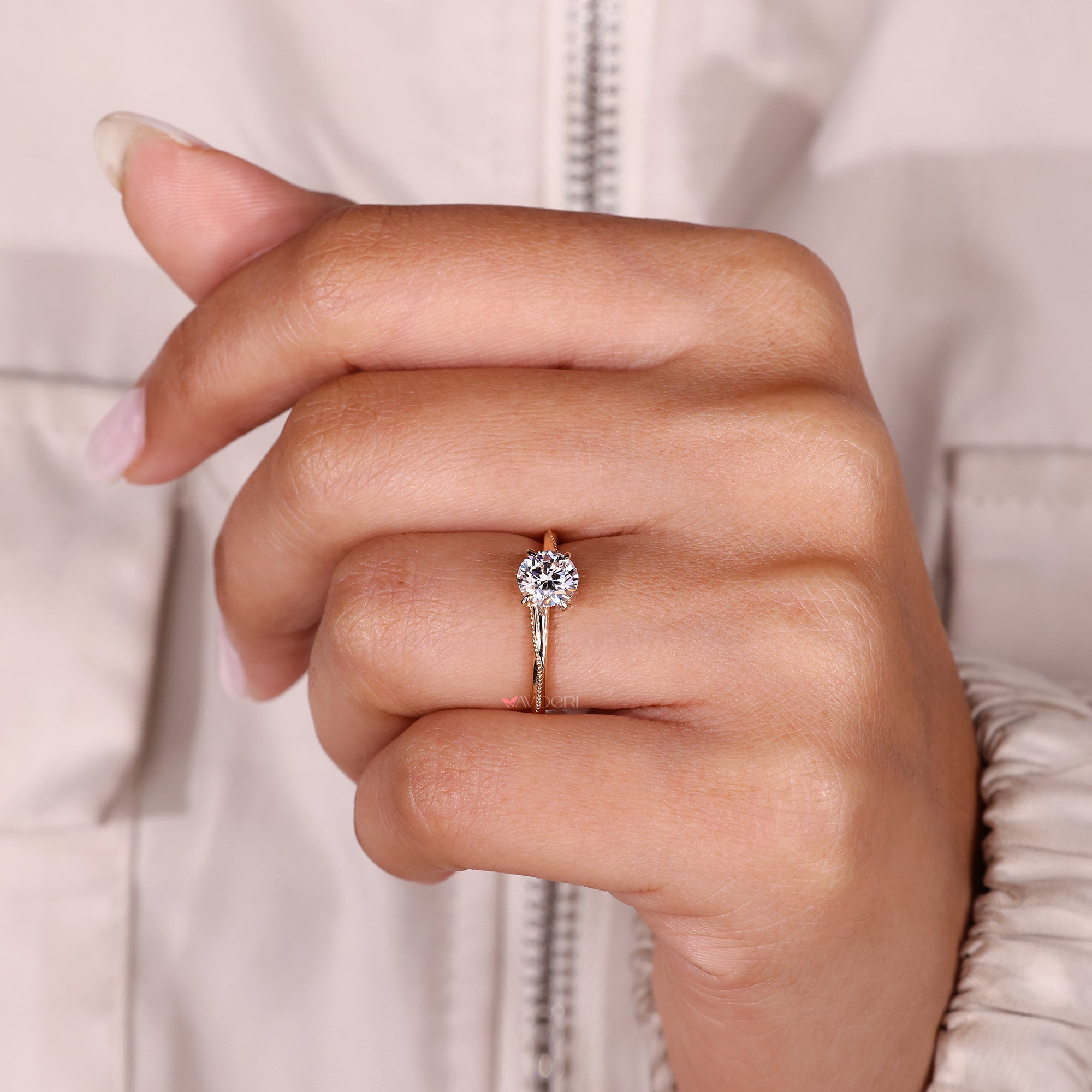 Handmade round cut diamond solitaire ring with milgrain.
