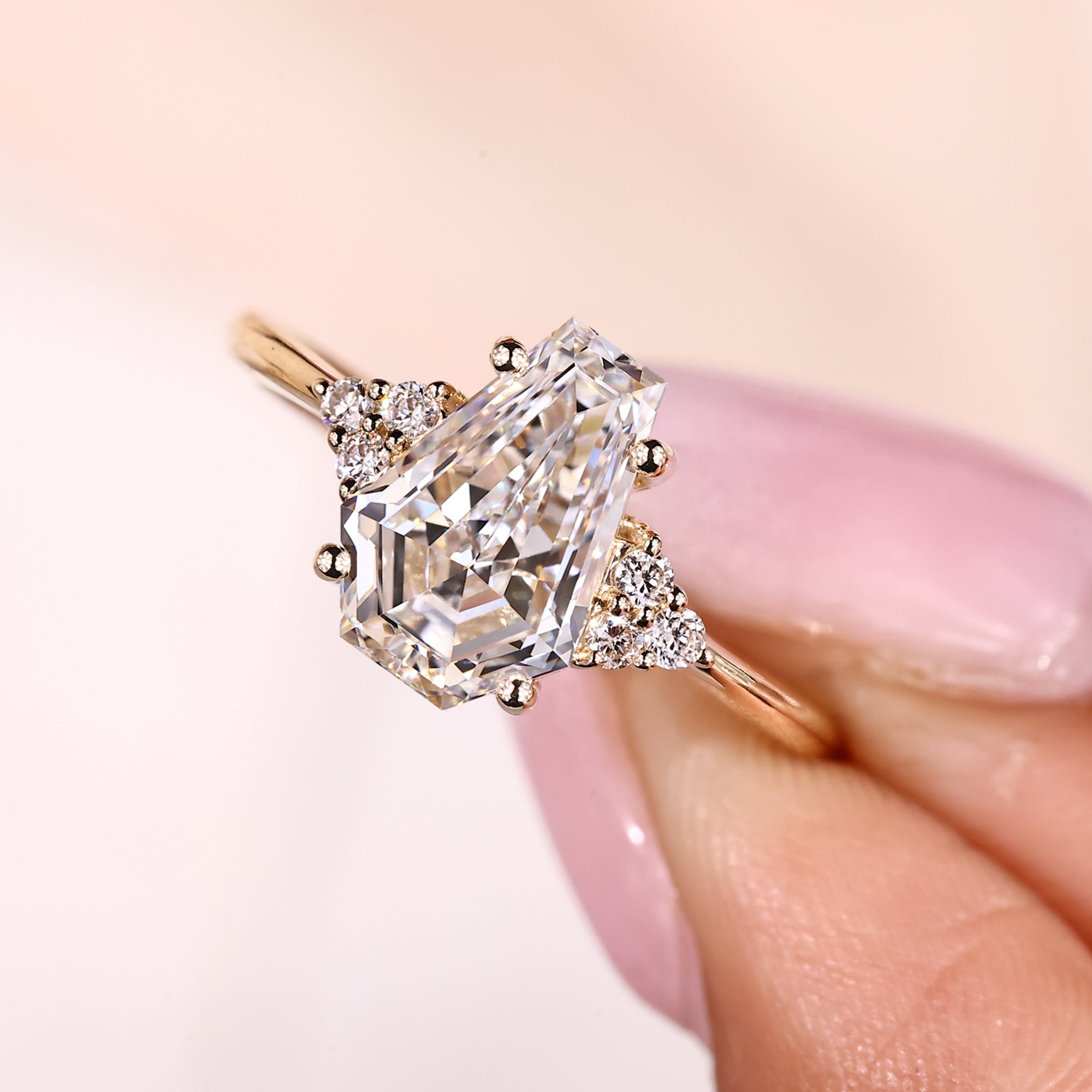 Seven stone ring with coffin cut diamond and round stones.