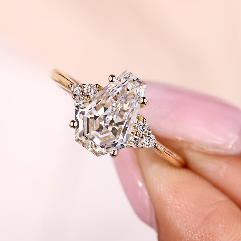 Seven stone ring with coffin cut diamond and round stones.
