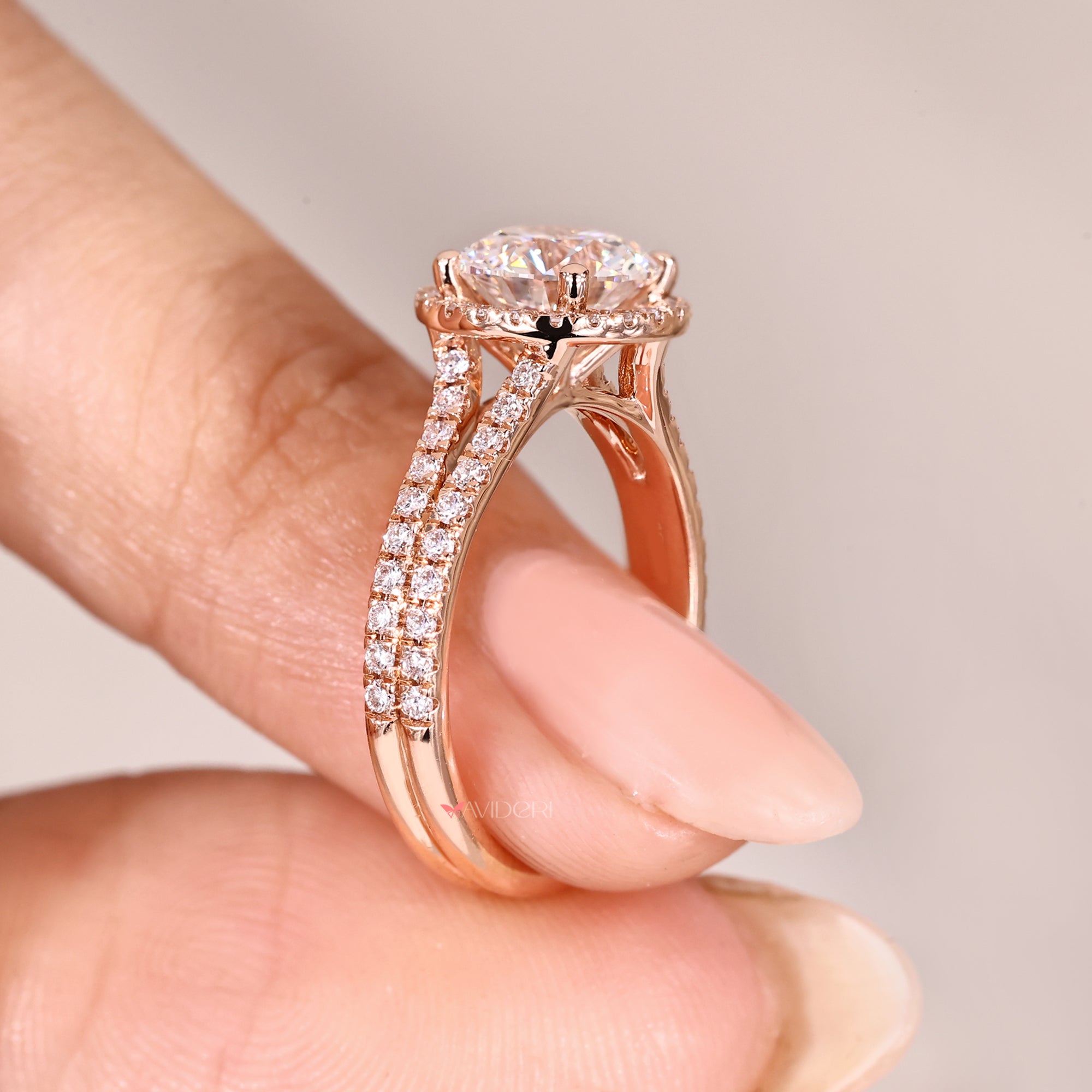 Lab grown round diamond halo engagement ring.

