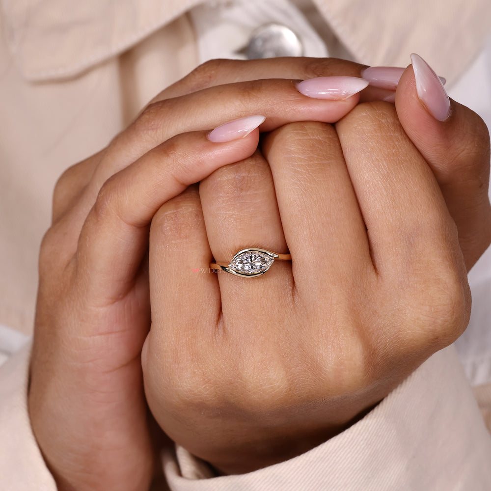 Handmade marquise diamond ring east west.
