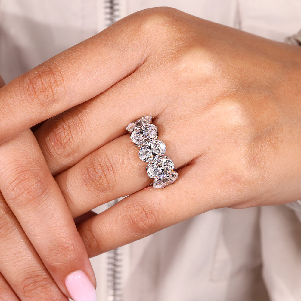 Unique wedding band with oval cut diamonds.