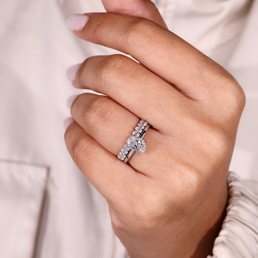 Oval cut diamond bridal set with four prong setting.
