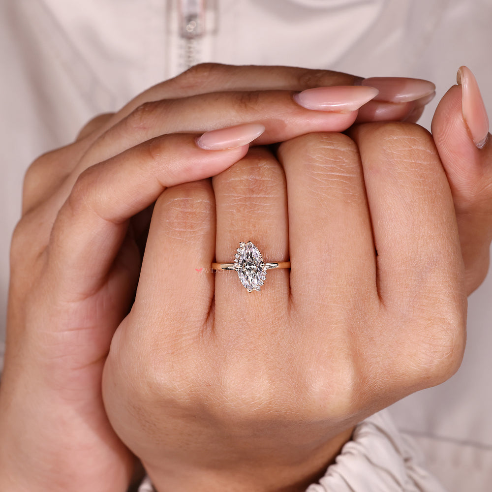 Vintage style marquise diamond ring with milgrain.
