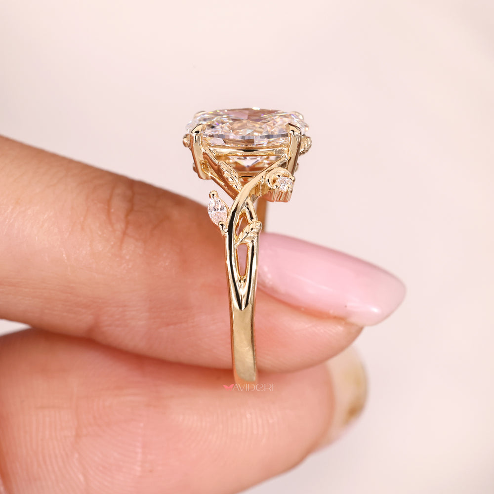 Four Claw Prong Oval Cut Diamond Ring in Yellow Gold.