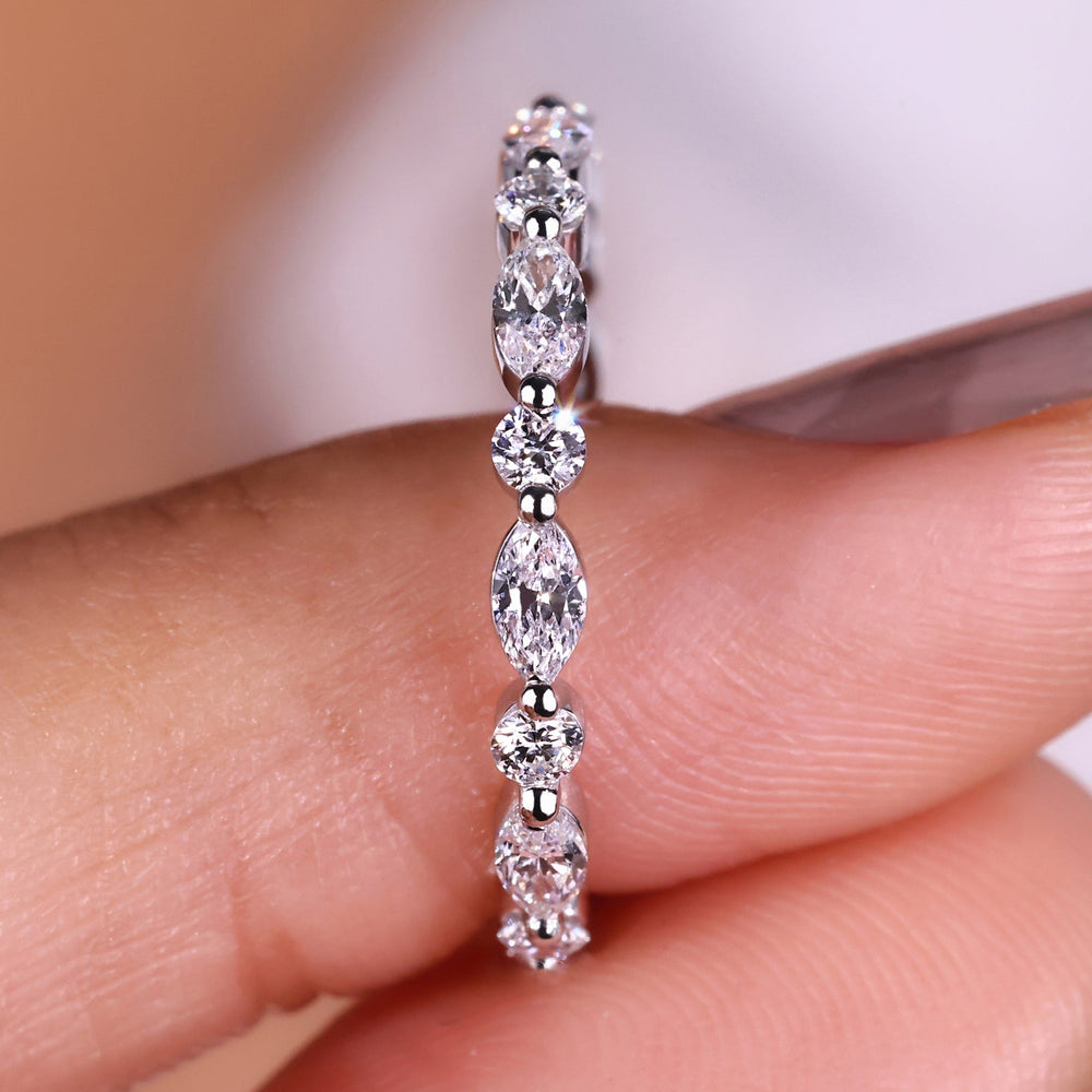 Marquise and round wedding band featuring a combination of stunning diamond cuts.

