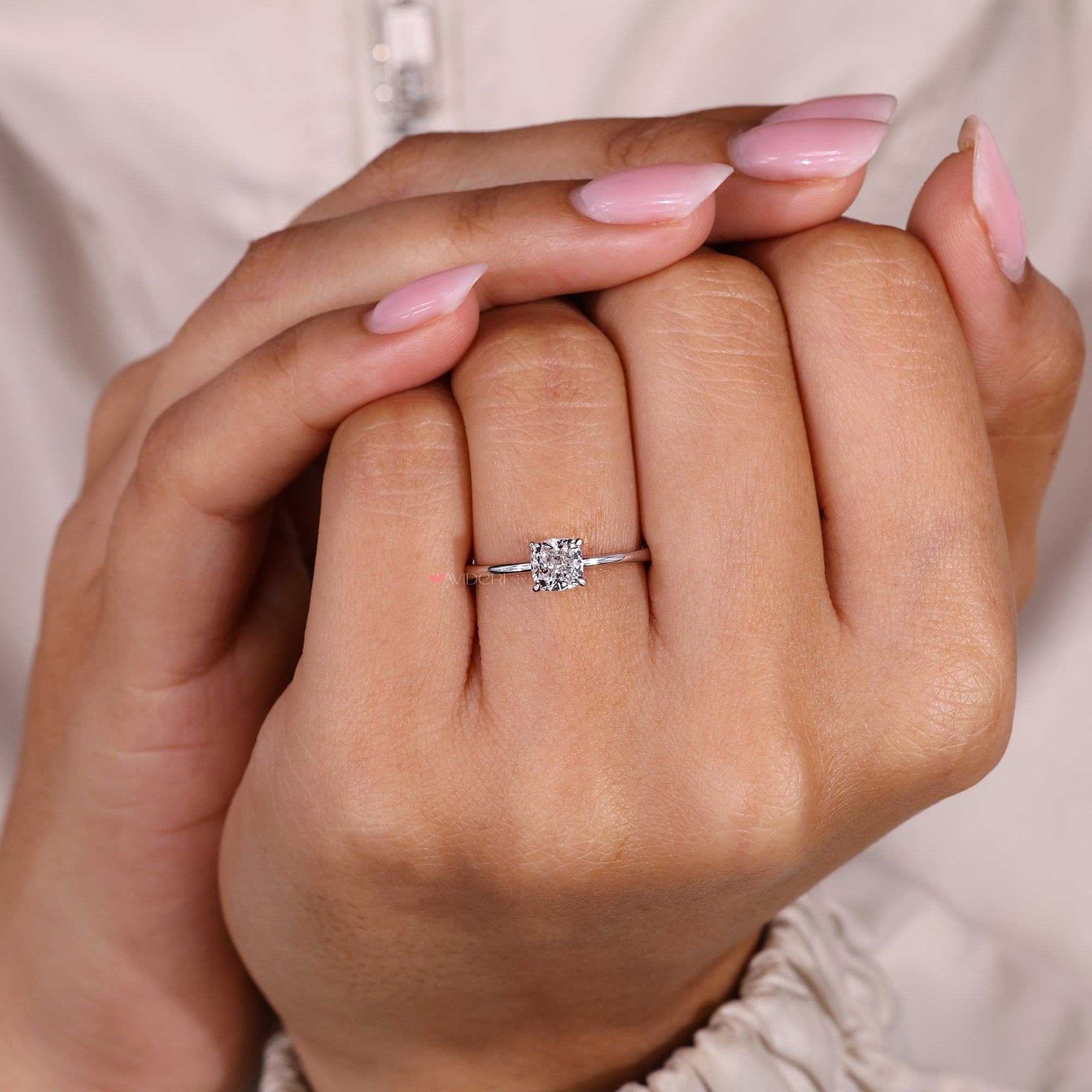 Handmade cushion cut ring with elegant prong setting.
