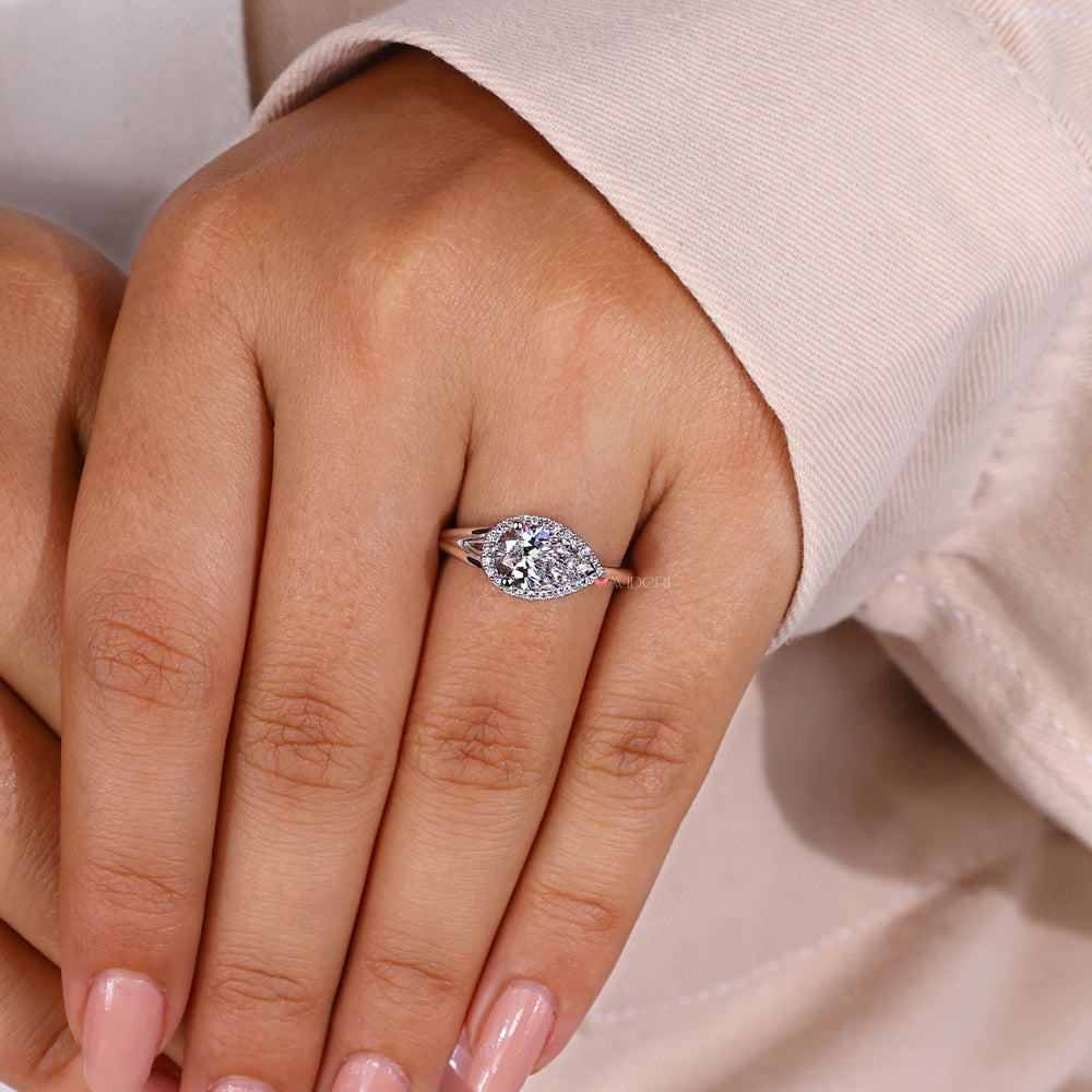 Handmade jewelry with a pear shaped engagement ring.
