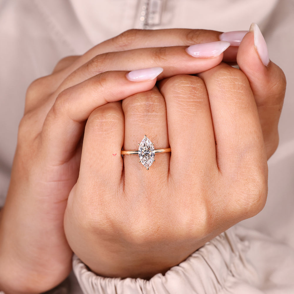 Lab grown marquise diamond ring with classic solitaire look.

