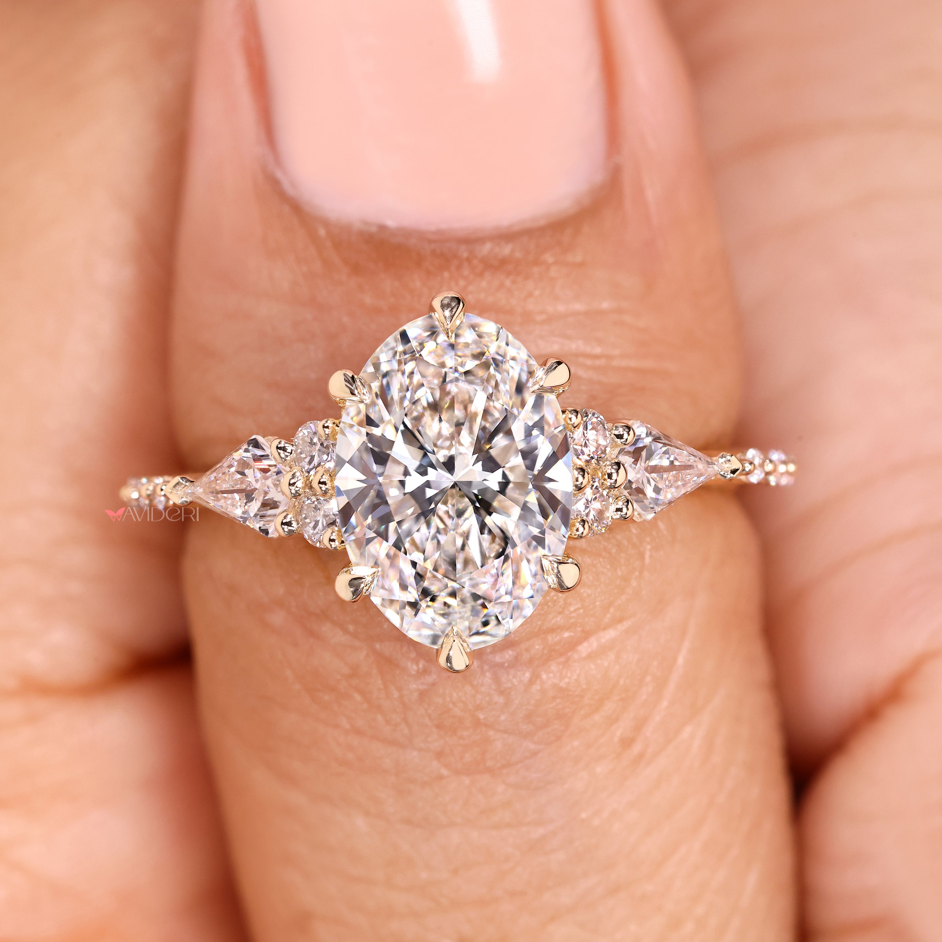 Handmade oval engagement ring with pave diamond accents
