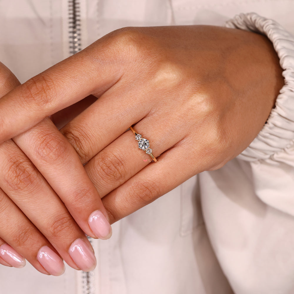 Round ring with three stone and prong setting.
