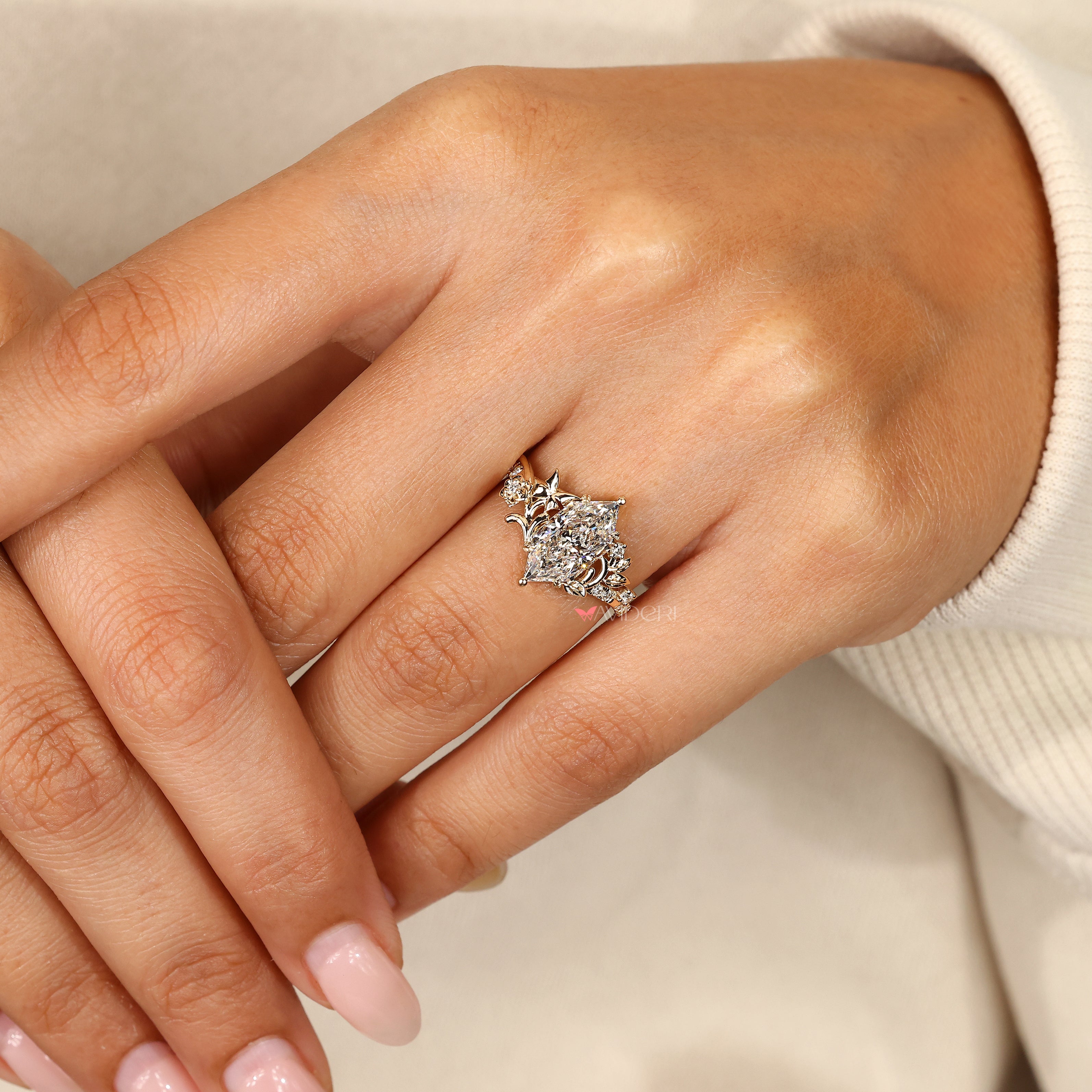 Marquise ring with four leaf style prongs.
