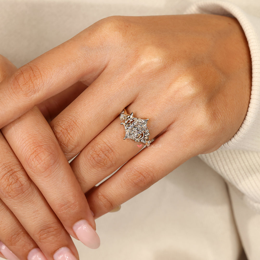 Marquise ring with four leaf style prongs.
