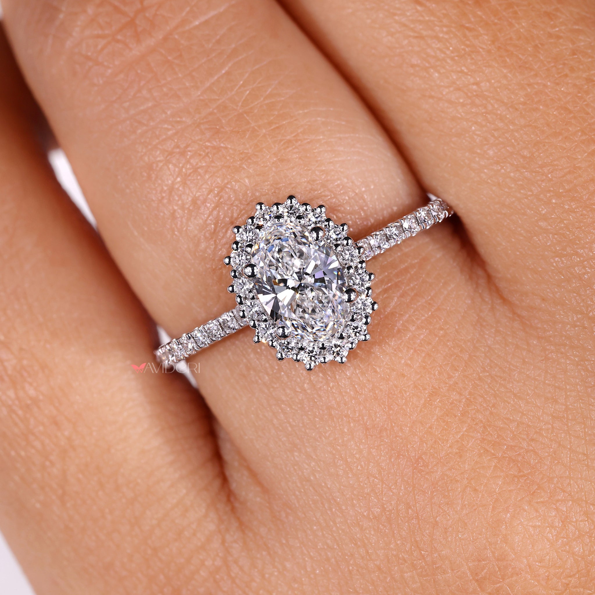 Halo ring showcasing a brilliant center stone surrounded by smaller diamonds
