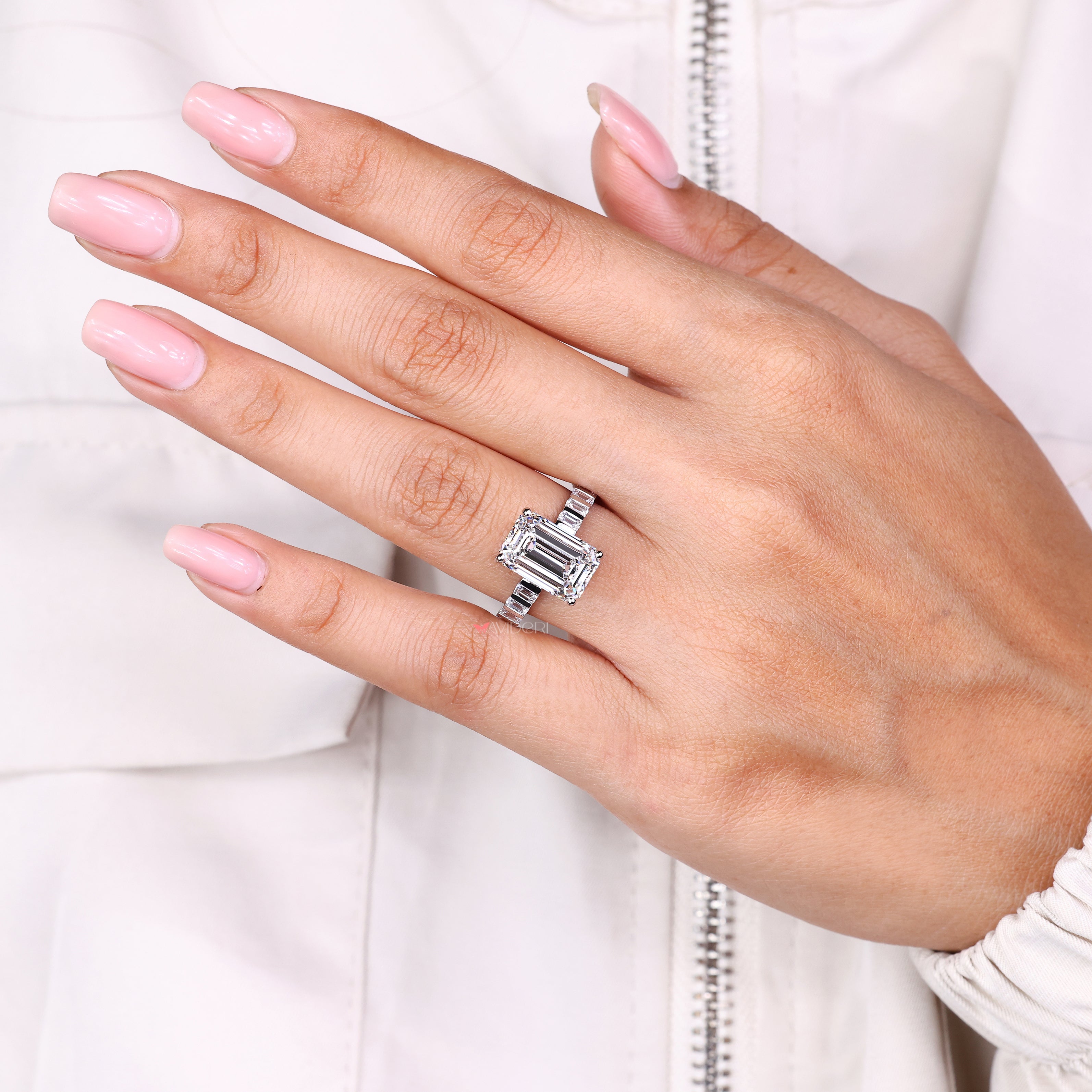 Avideri emerald diamond ring with small side diamond accents
