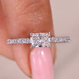 Radiant cut diamond ring with east to west setting.