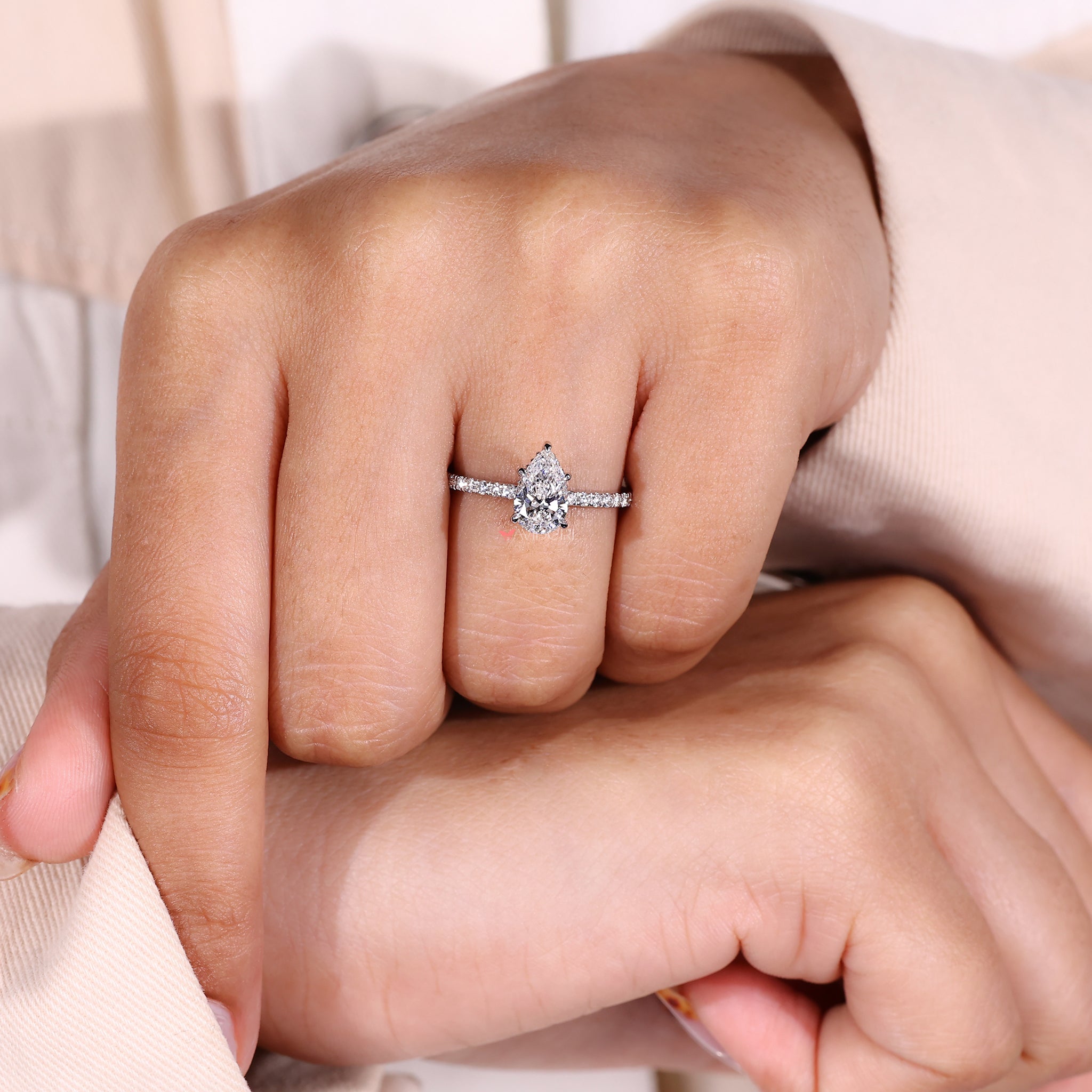 Round Cut Ring with a pear-shaped diamond for a modern twist.