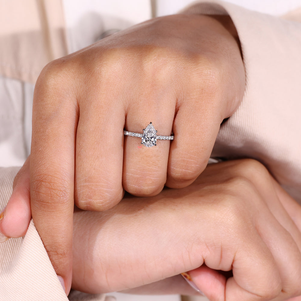 Round Cut Ring with a pear-shaped diamond for a modern twist.