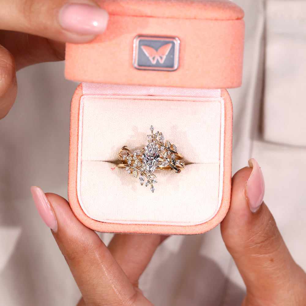 Marquise engagement ring with leaf detailing.
