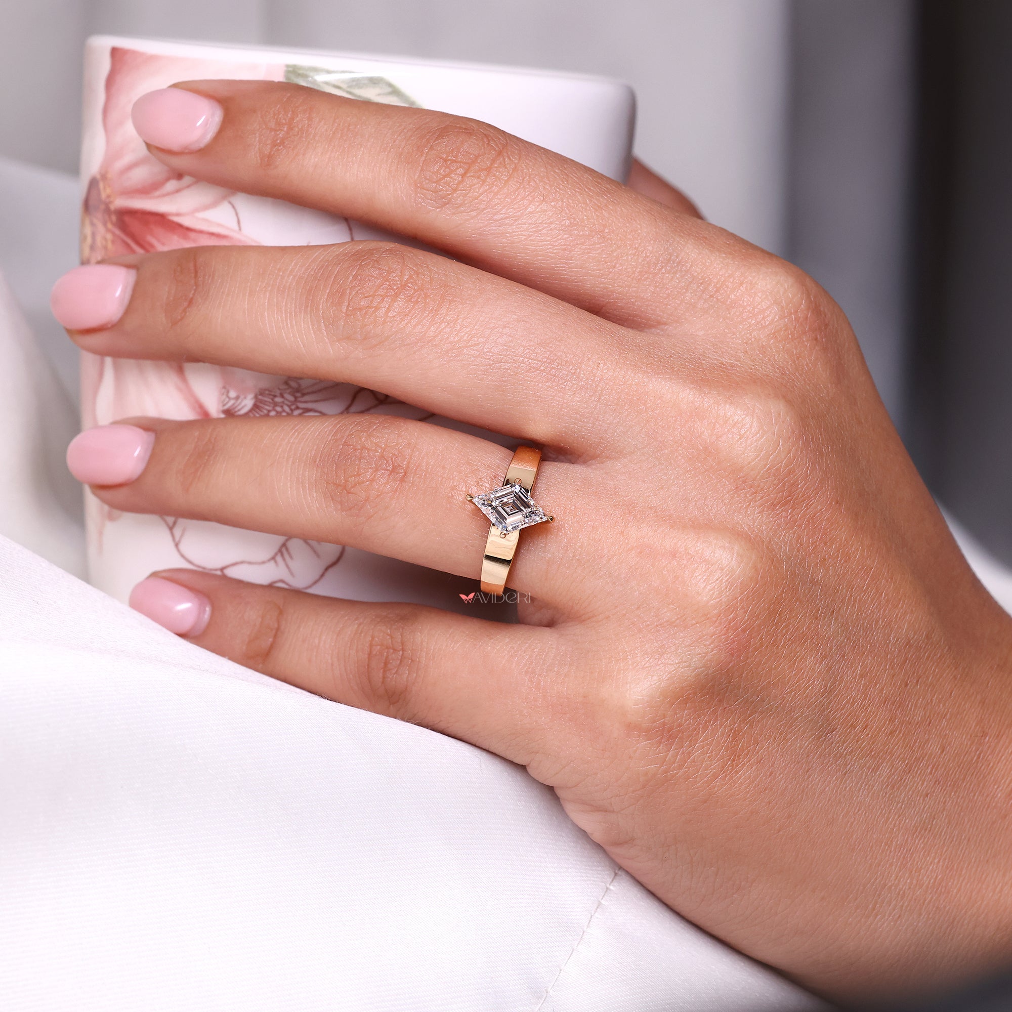 Lab-grown diamond ring in compass prong ring.