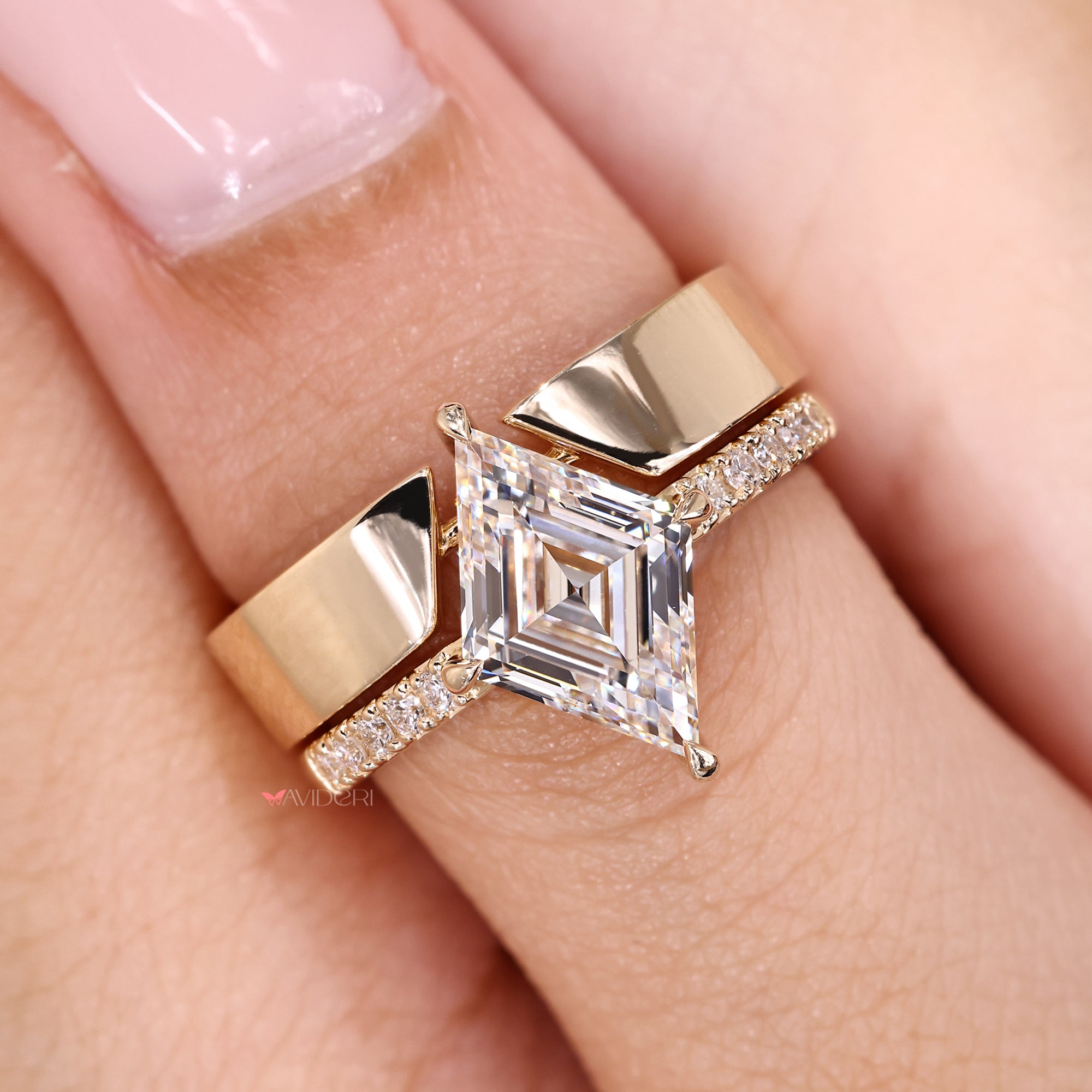Lab grown lozenge diamond ring with plain band.
