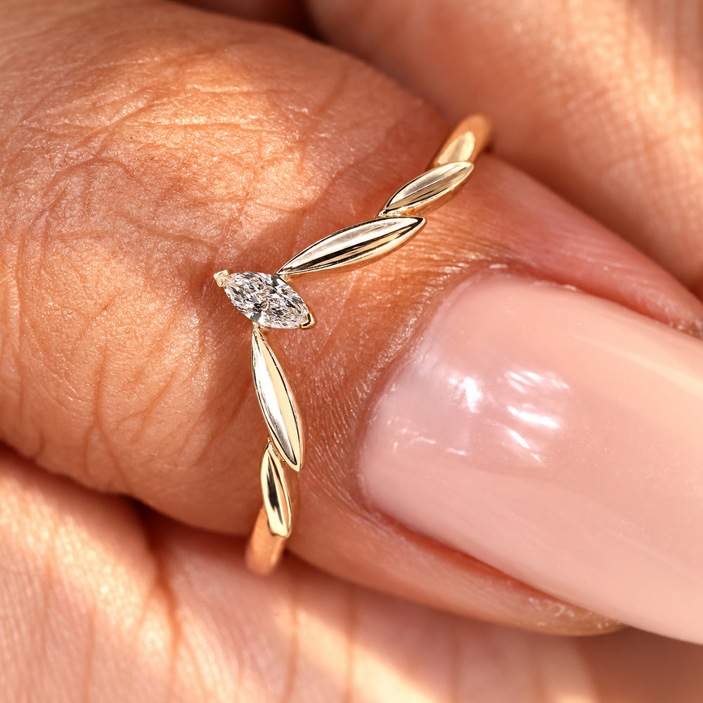 Marquise cut diamond band with a V shaped setting.
