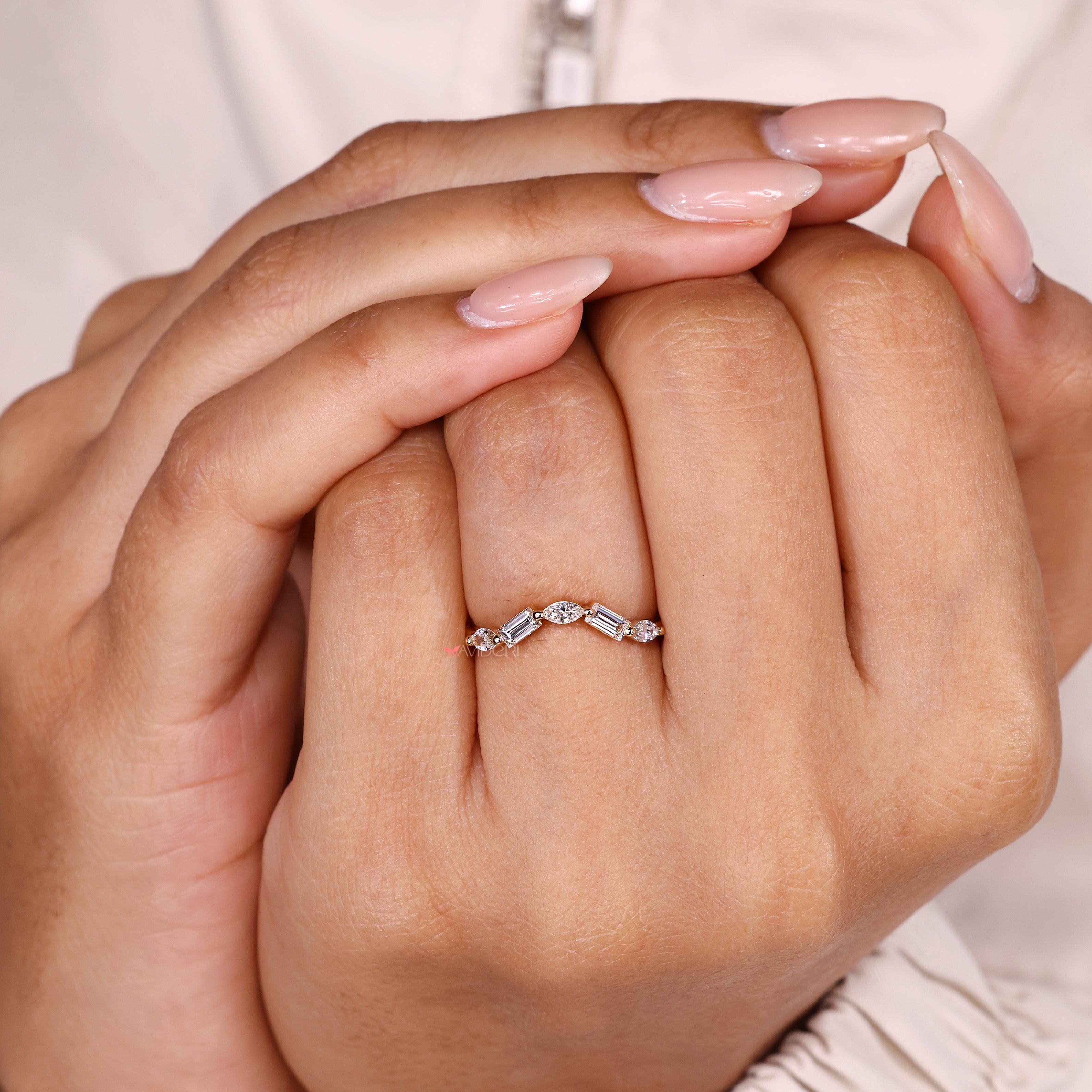 Avideri curved wedding band with marquise and baguette diamonds.

