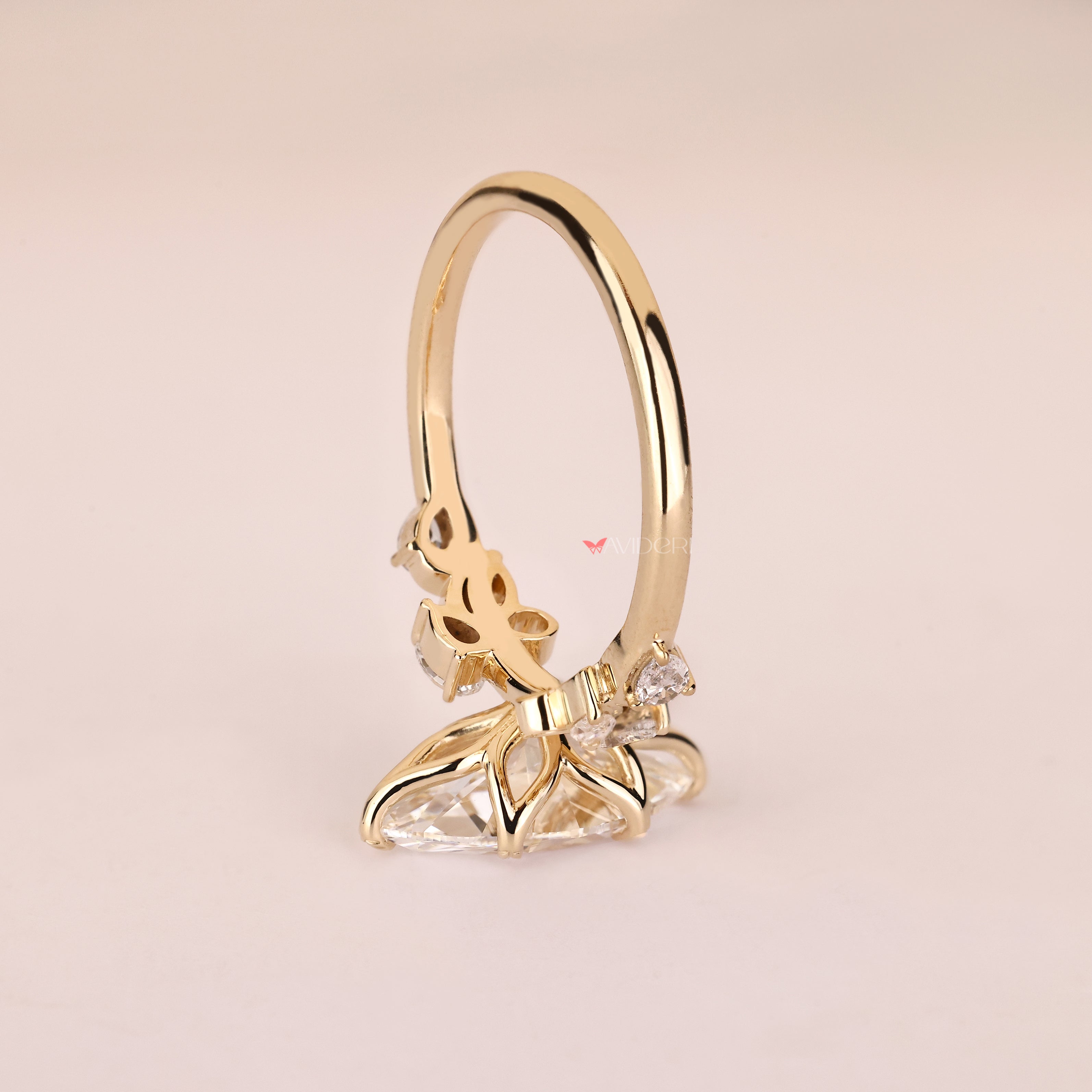 Lab grown marquise diamond ring with six leaf style prongs
