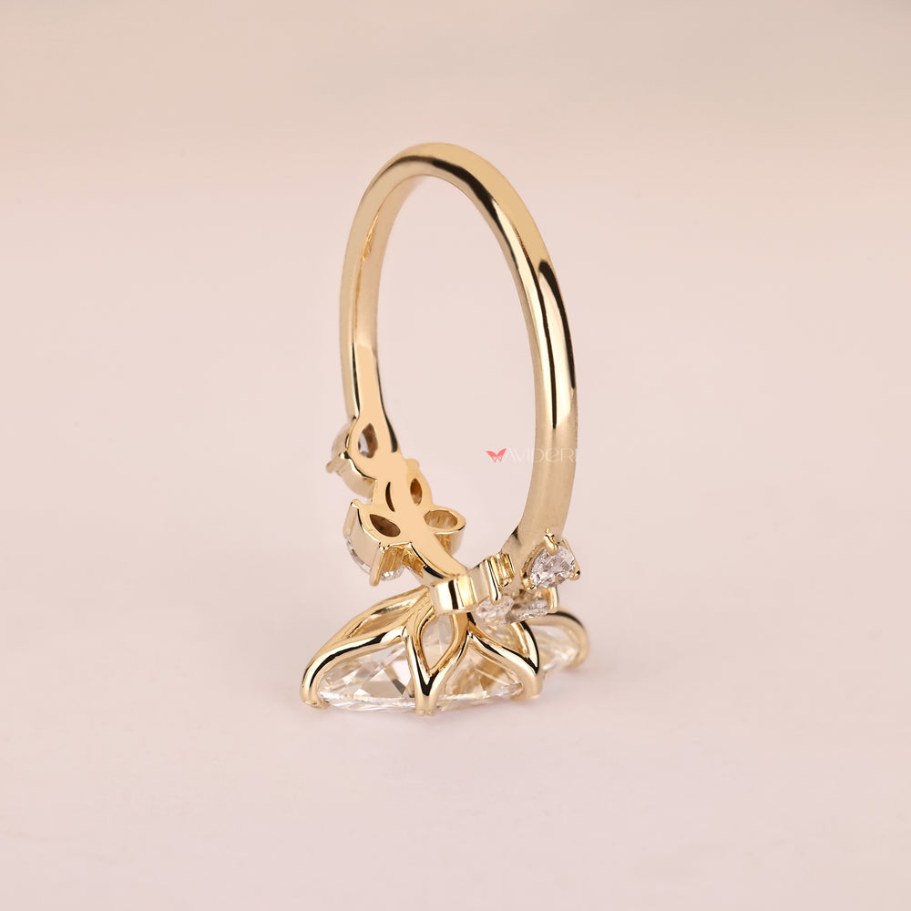 Lab grown marquise diamond ring with six leaf style prongs
