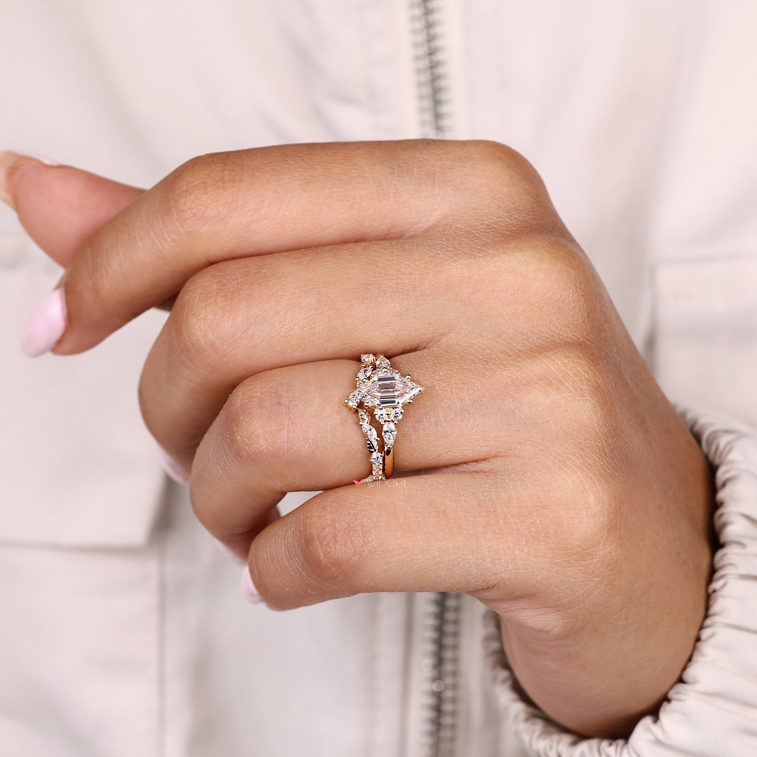 IGI certified hexagon diamond ring with marquise side stone accents
