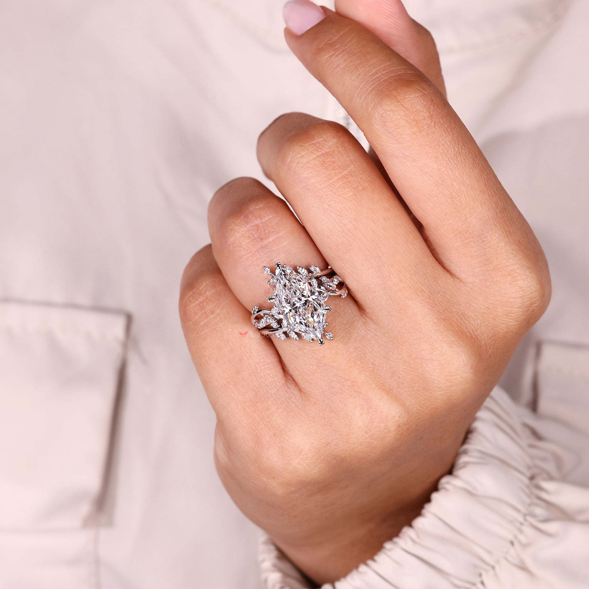 Nature inspired ring with marquise side stones.
