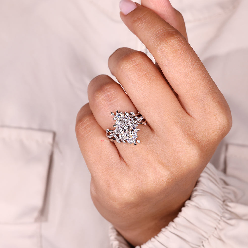 Nature inspired ring with marquise side stones.
