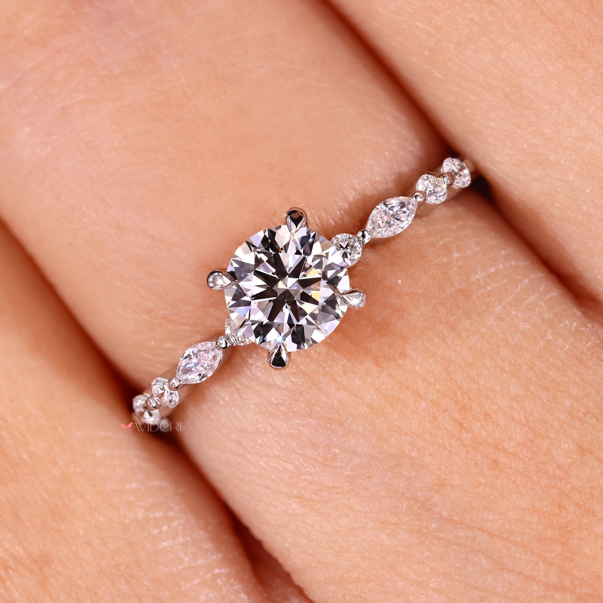 Marquise cut side stone ring in fine craftsmanship.