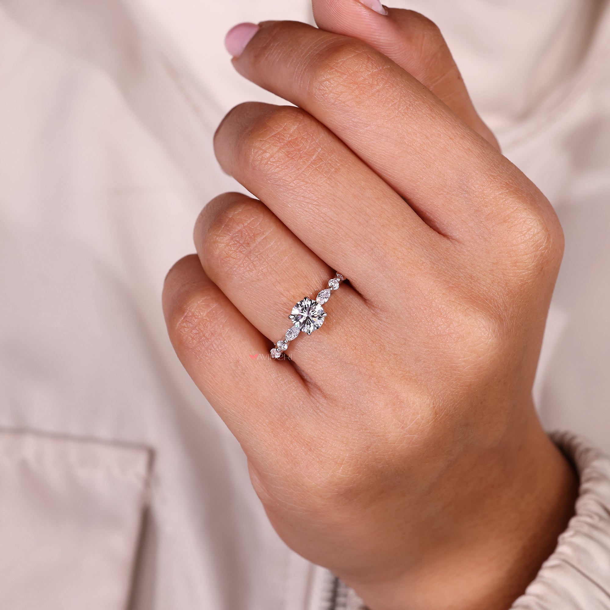 IGI certified round diamond ring with side stones.