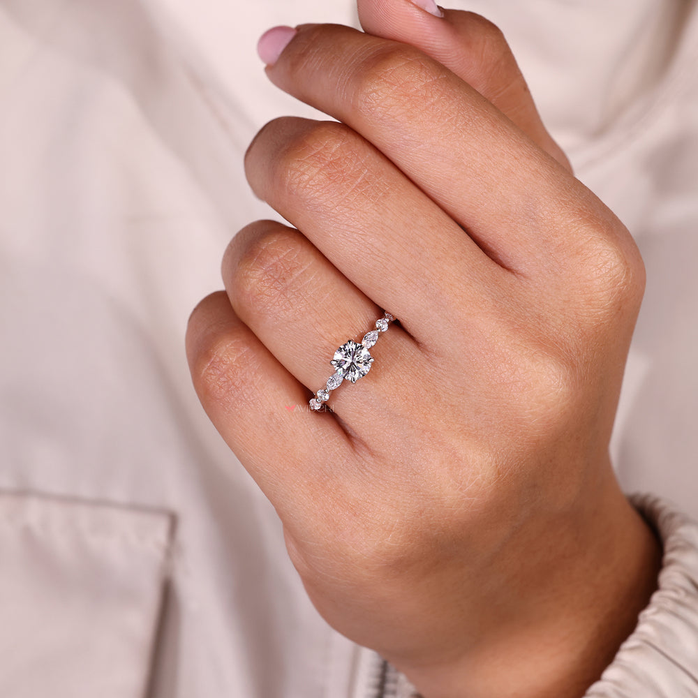 IGI certified round diamond ring with side stones.