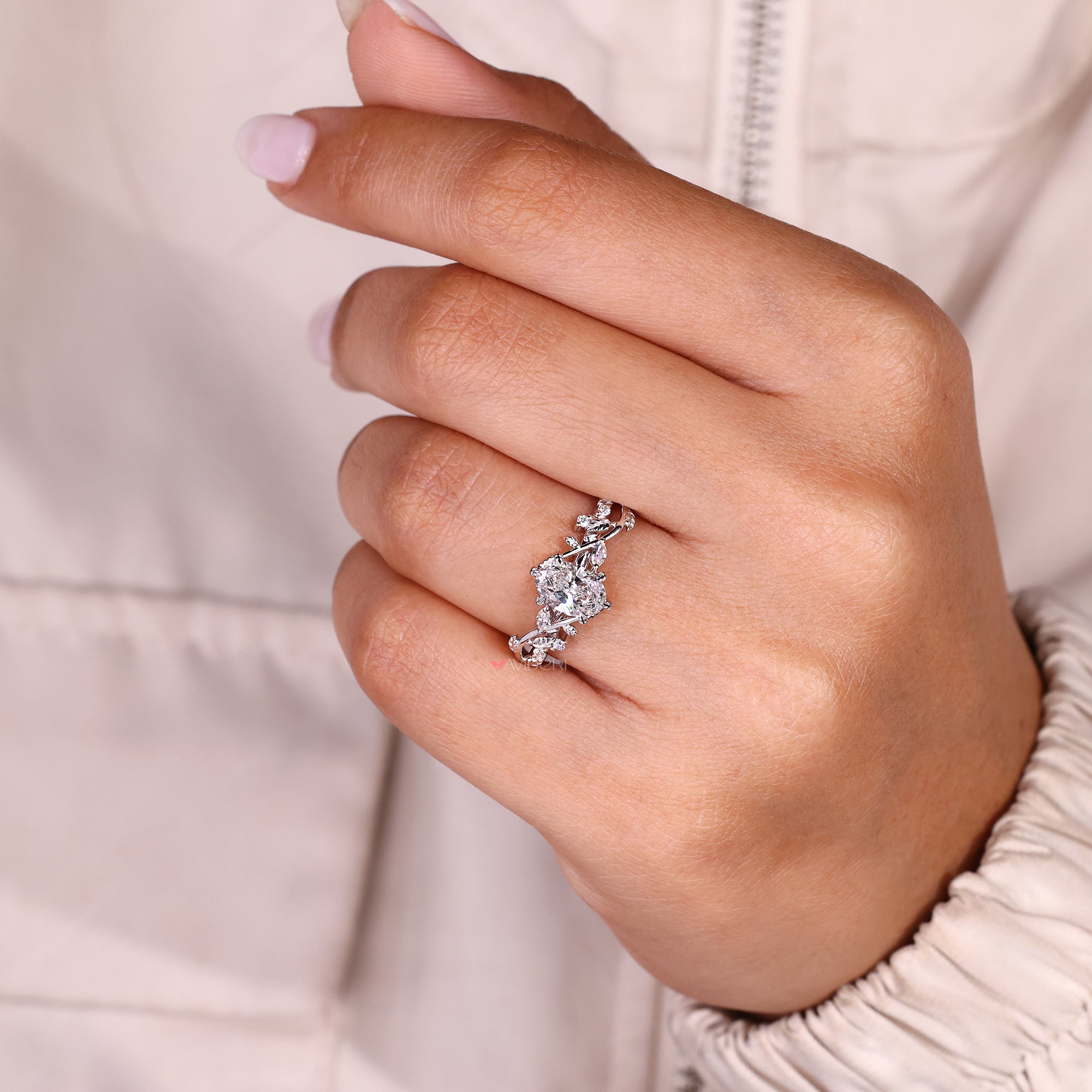 Oval cut diamond ring featuring hand engraved filigree details.
